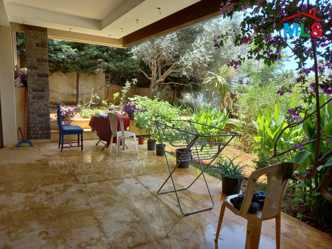 A Spacious Apartment with Garden for Sale in Haret Sakher