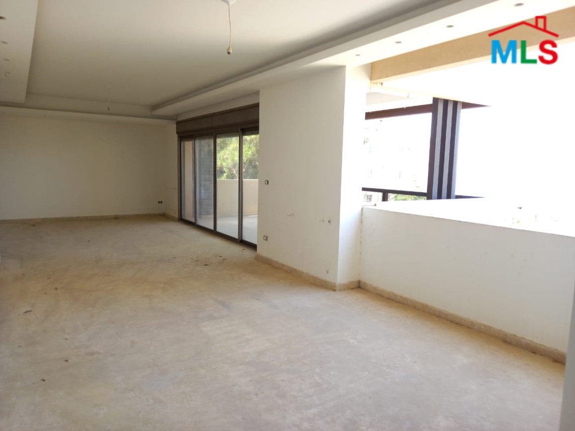 A Spacious Apartment with Garden for Sale in Haret Sakher