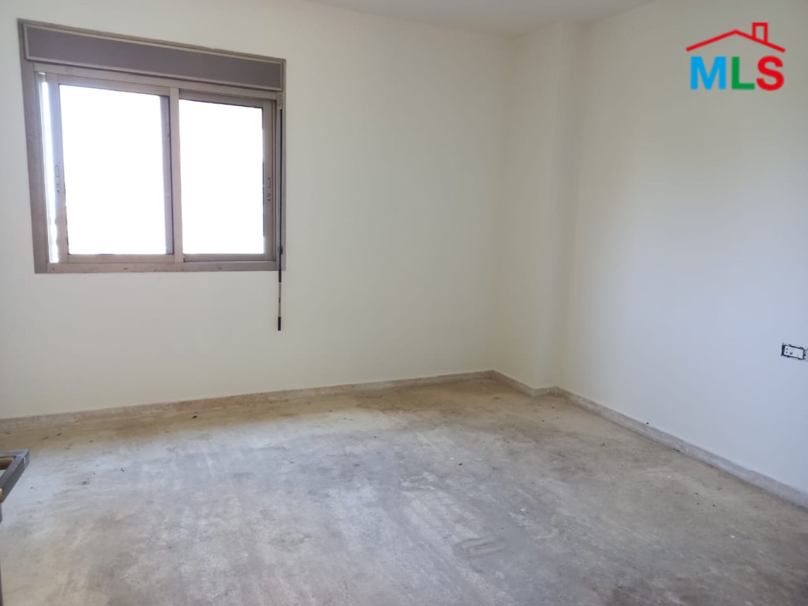 A Spacious Apartment with Garden for Sale in Haret Sakher