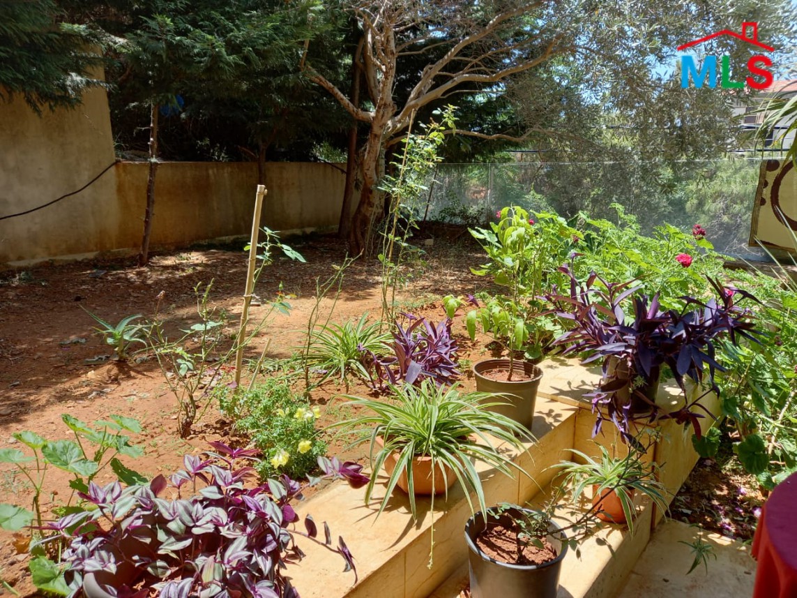 A Spacious Apartment with Garden for Sale in Haret Sakher