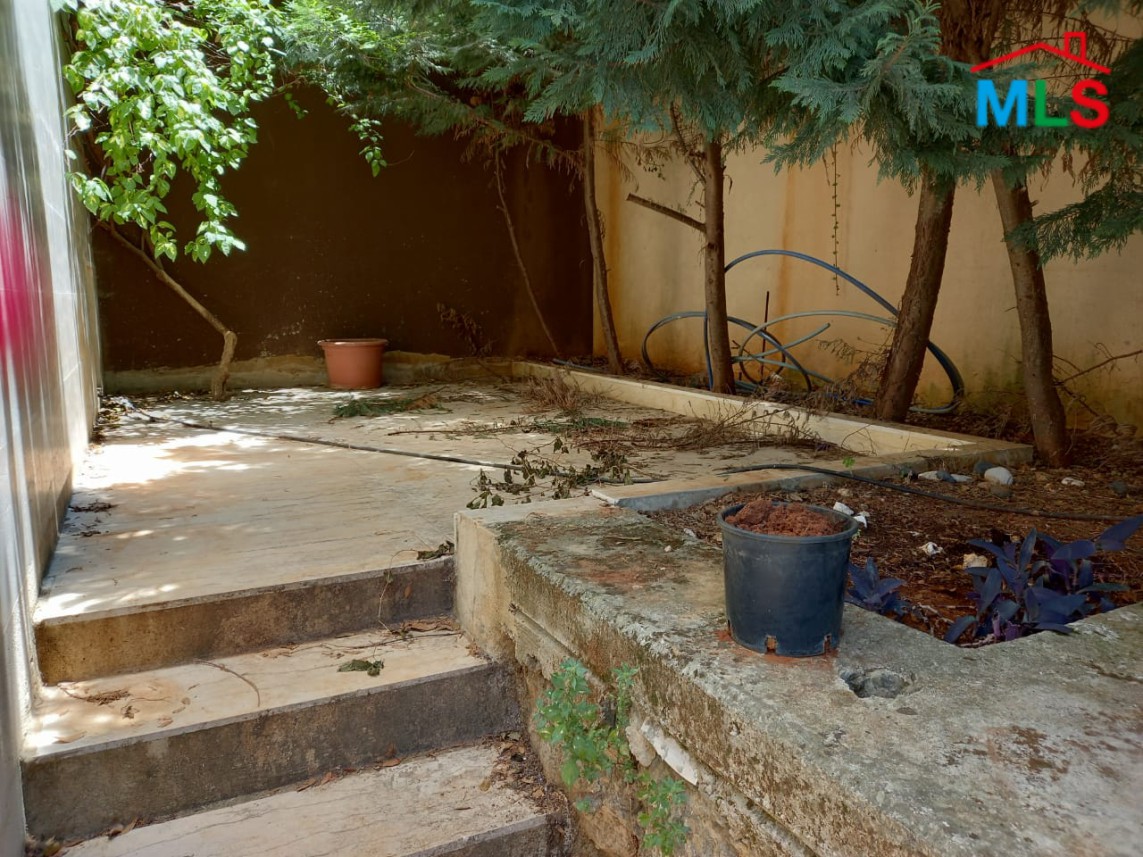 A Spacious Apartment with Garden for Sale in Haret Sakher