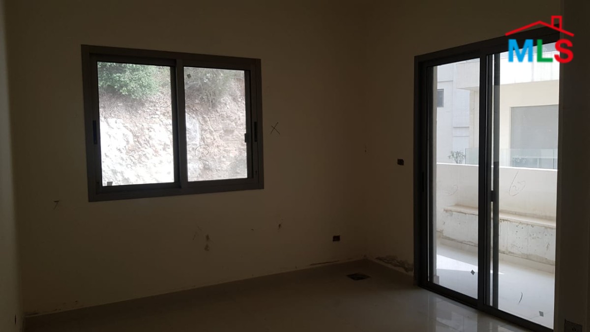 A Cozy Apartment for Sale in Tabarja with Shared Pool