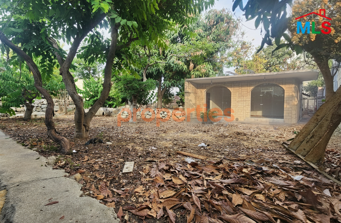 Land with house and shops for sale in Aamchit – Jbeil – CPJMH20