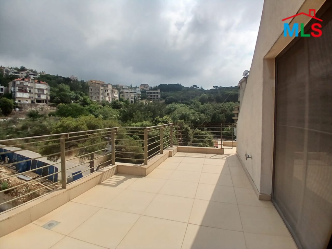 Unfurnished Roof Apartment With a Nice View For Rent in Qornet El Hamra