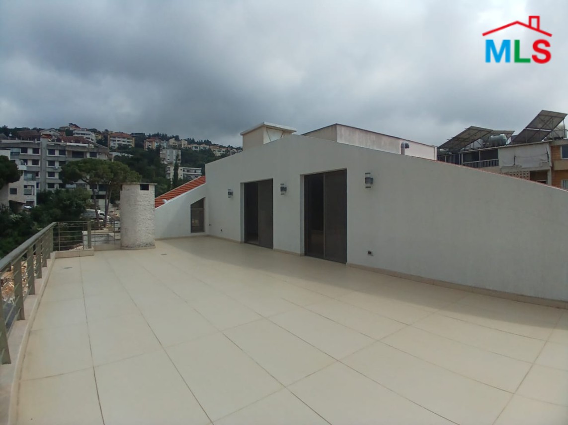 Unfurnished Roof Apartment With a Nice View For Rent in Qornet El Hamra
