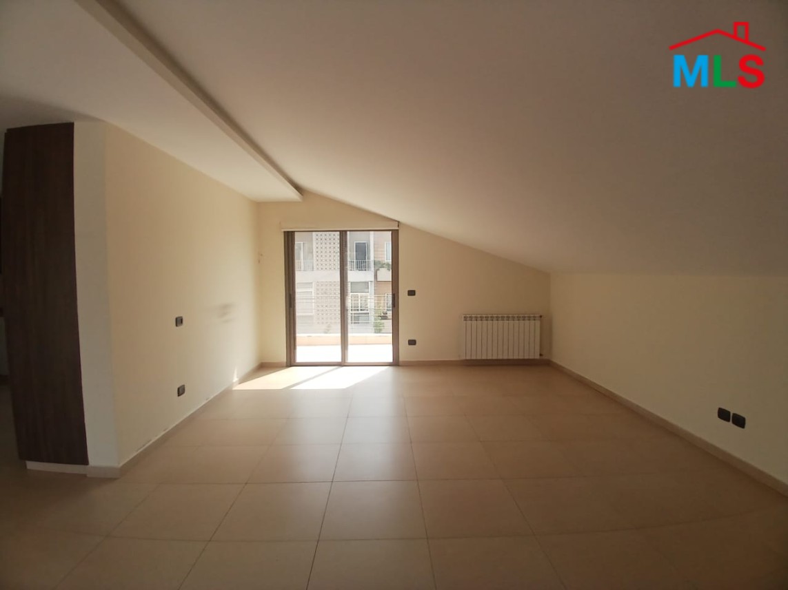 Unfurnished Roof Apartment With a Nice View For Rent in Qornet El Hamra