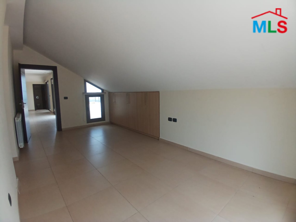 Unfurnished Roof Apartment With a Nice View For Rent in Qornet El Hamra
