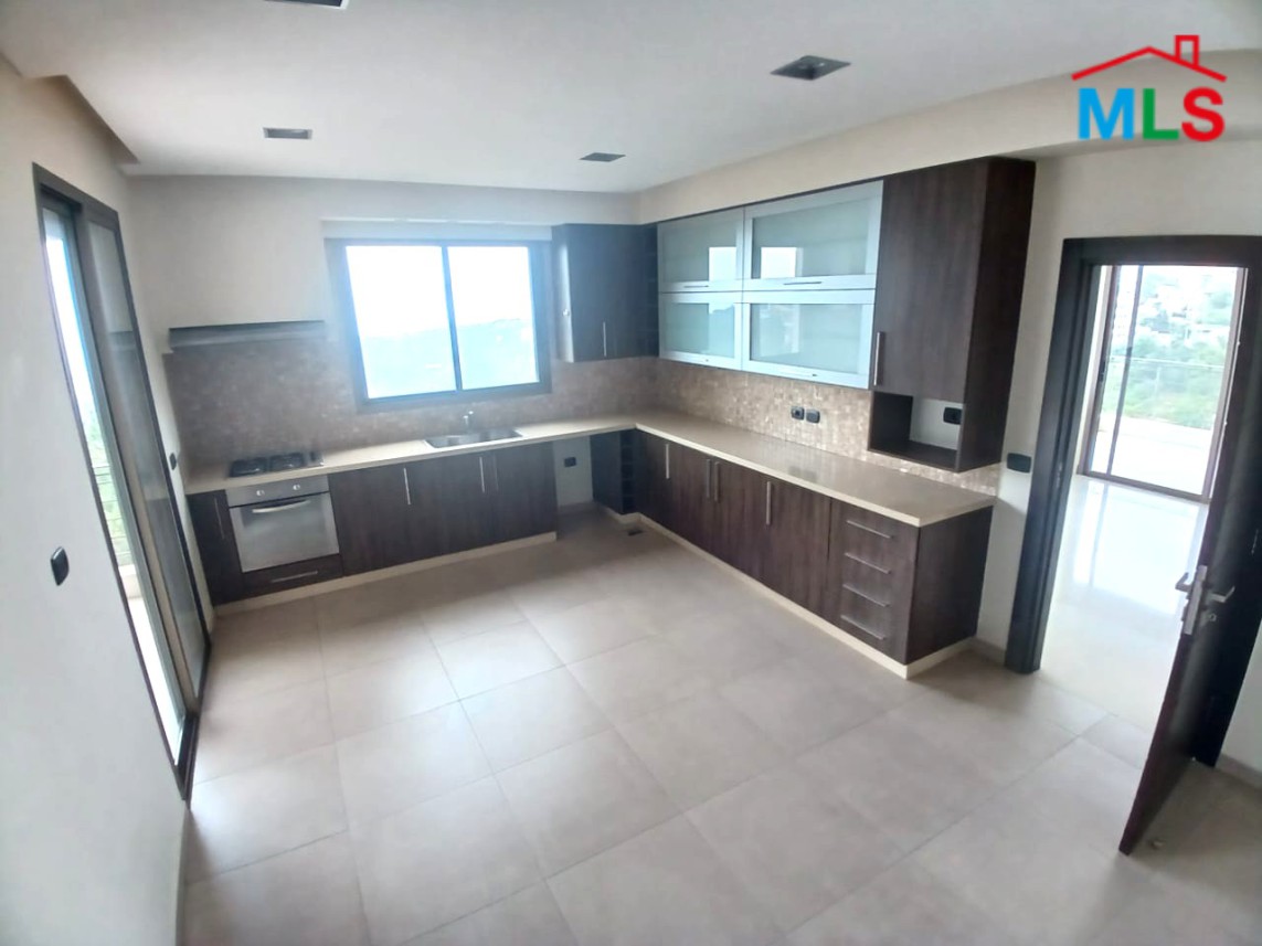 Unfurnished Apartment With a Nice View For Rent in Qornet El Hamra