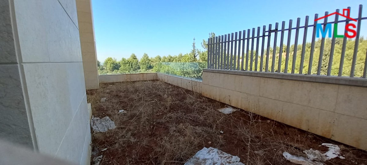 A Deluxe Apartment for Rent in Adma with Garden and Open Sea View
