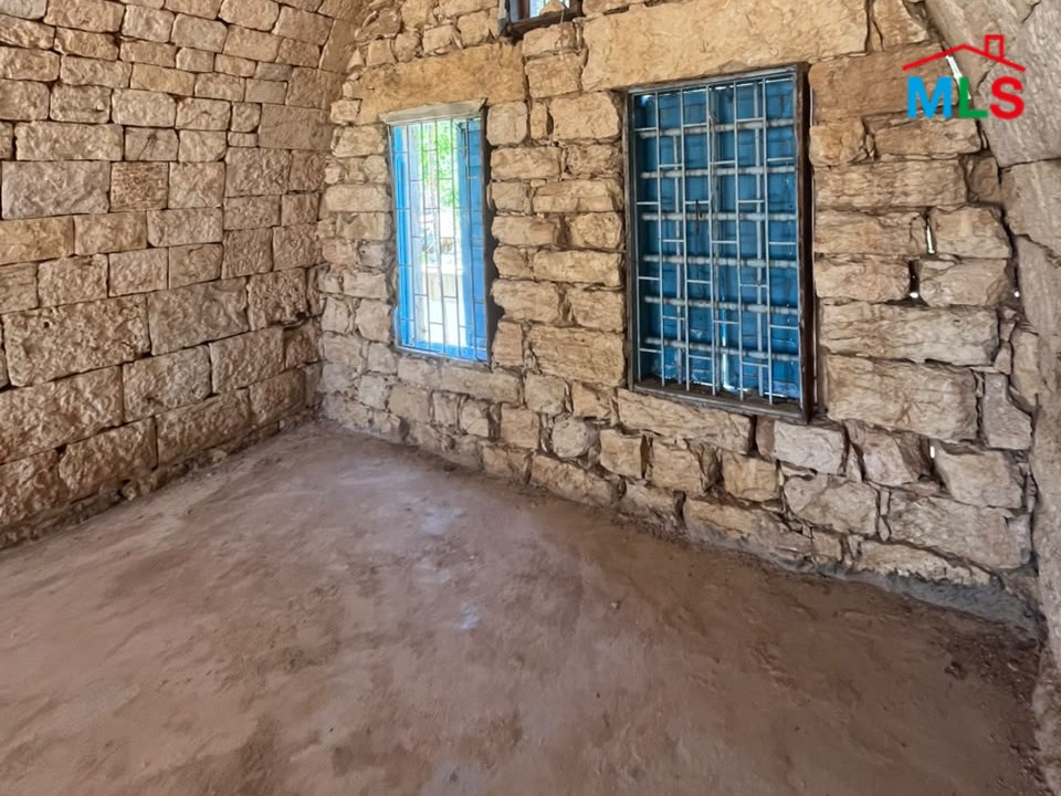 1,100 SQM Land with Traditional Stone House For Sale in Koura