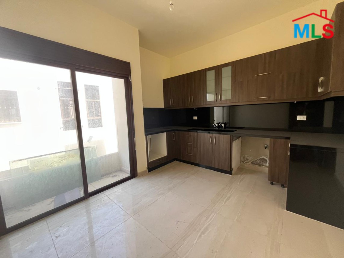 Bright Apartment with Terrace & Mountain View For Sale in Koura