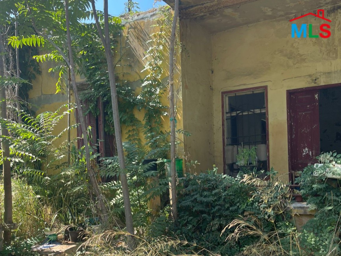 409 SQM Land with Old House For Sale in Karantina