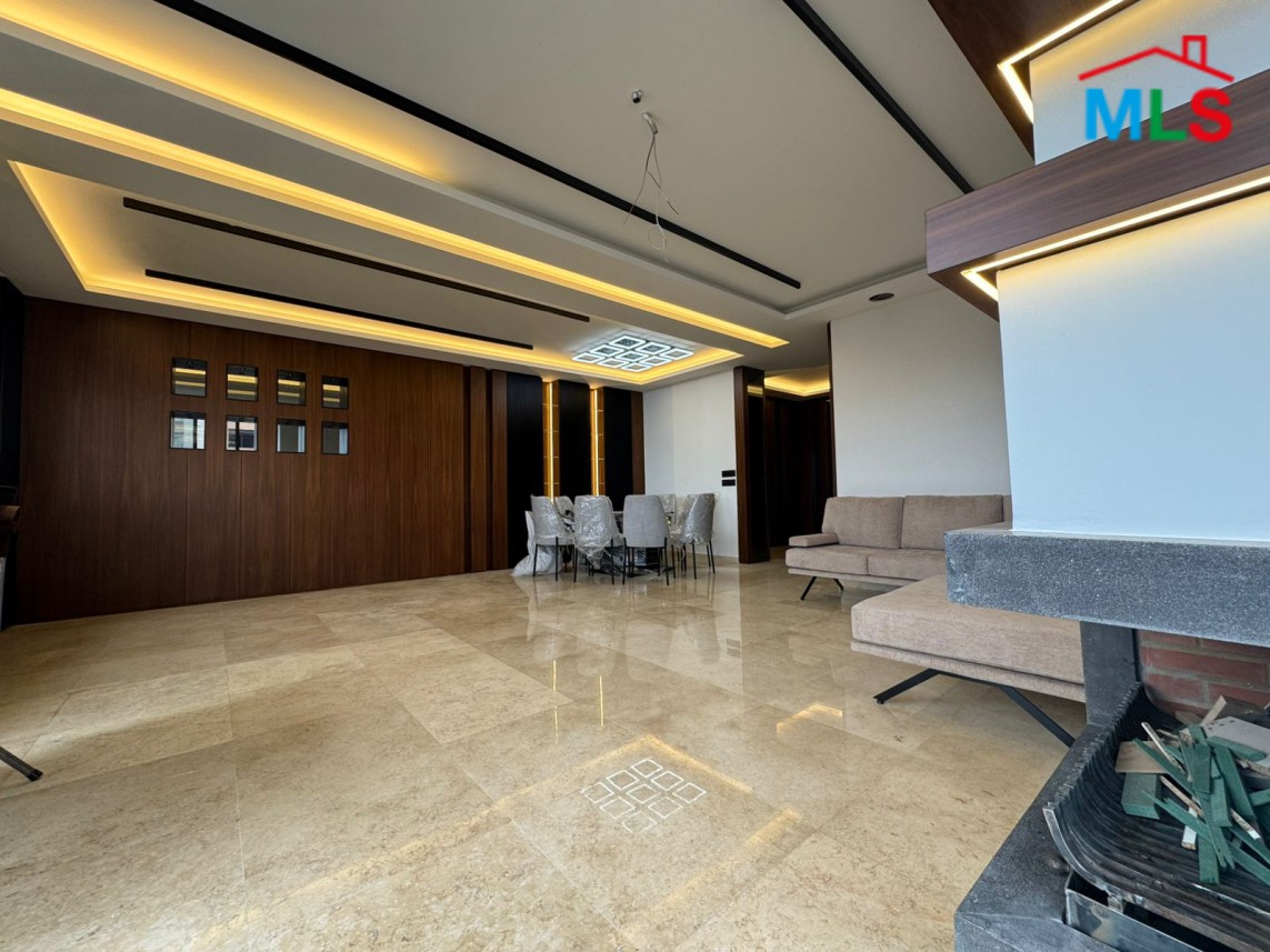 Brand New Decorated Apartment With A Large Terrace For Sale in Tilal Ain Saade